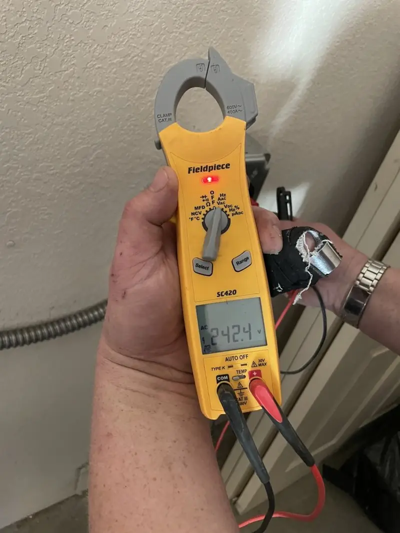 Voltage testing with clamp meter during Recessed Lighting Installation in Foxborough